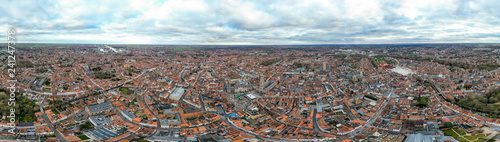 Panoramic aerial view of Bruges from above of historic city is distinguished by its canals, cobbled streets and medieval buildings with historical landmarks and city town center in Belgium