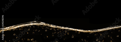 Champagne bubbles with surface, macro, horizontal, background