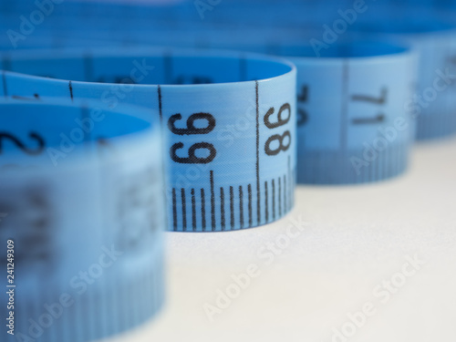 Isolated blue measuring tape