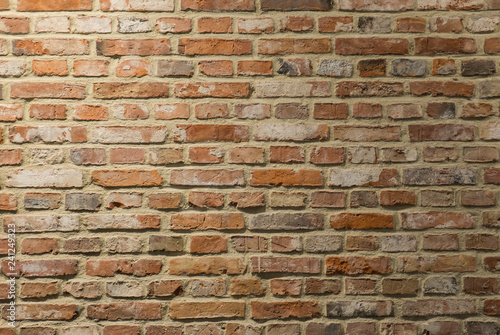 Masoned and aged red brick wall