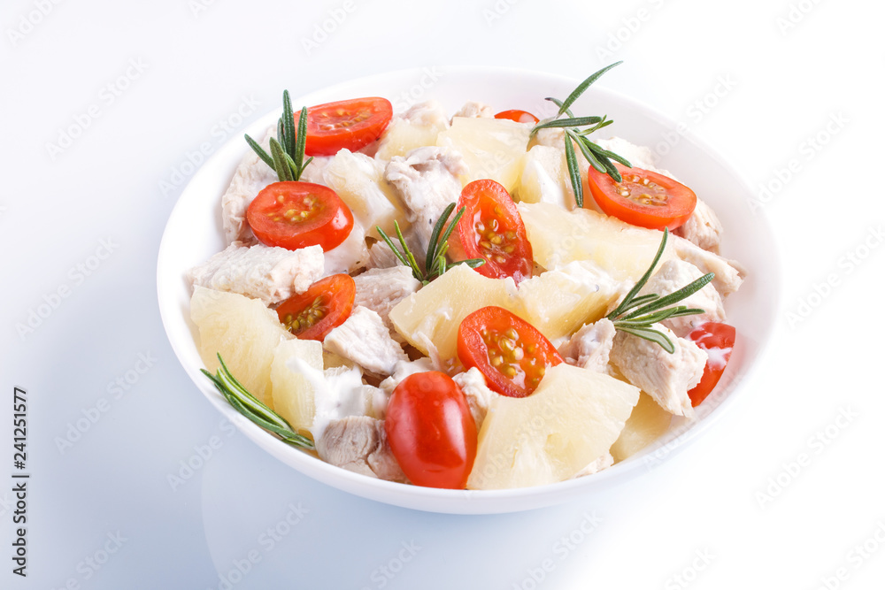 Chicken fillet salad with rosemary, pineapple and cherry tomatoes isolated on white background. Chicken fillet salad with rosemary, pineapple and cherry tomatoes isolated on white background.