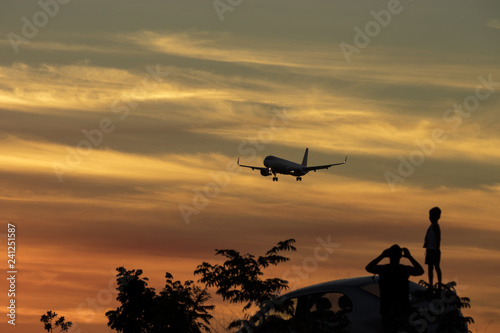 Sunset plane landing