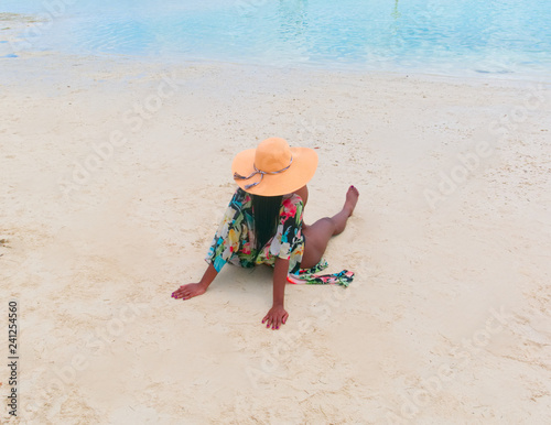 Beautiful black woman relaxing on beach 
