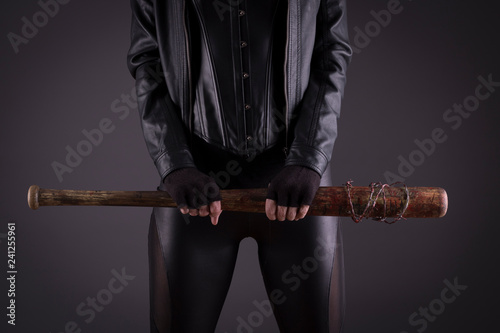 Sexy female assassin with a bat