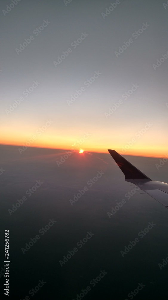 Fototapeta premium airplane flying over sea