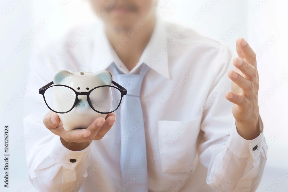 Businessman with piggy bank Piggy bank saving concept Businessman with piggy bank Piggy bank saving concept