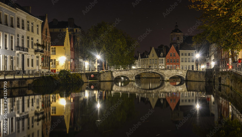 Scenic city view of Bruges canal at night