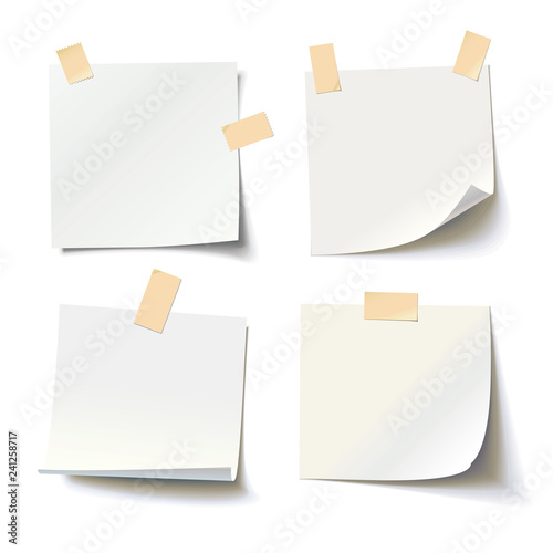Collection of various white note papers with curled corner and adhesive tape