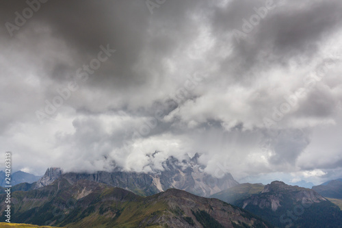 Beautiful scenery in the Dolomite Alps, with rain clouds, mist, and limestone peaks