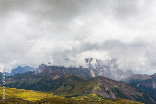 Fototapeta Naklejka Na Ścianę i Meble -  Beautiful scenery in the Dolomite Alps, with rain clouds, mist, and limestone peaks