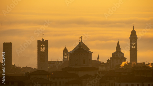 Bergamo, one of the most beautiful city in Italy. Amazing landscape of the old town and the fog covers the plain at sunrise © Matteo Ceruti