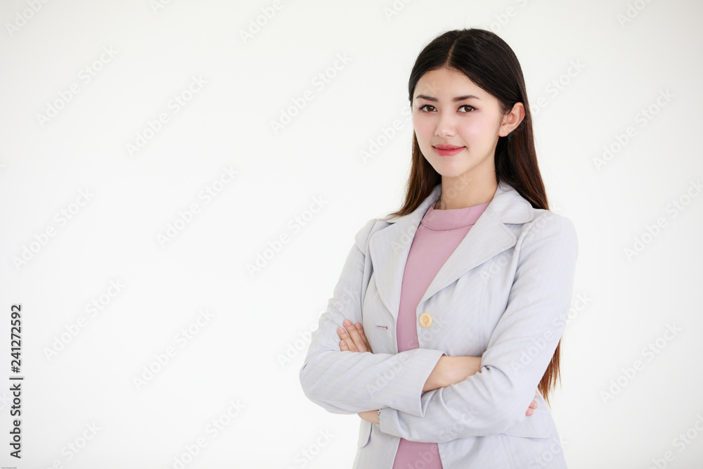 Young beautiful Asian woman with black long hair standing in front of white background Young beautiful Asian woman with black long hair standing in front of white background