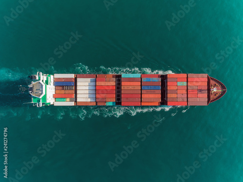 Aerial top view container ship full load container top speed for logistics import export, shipping or transportation.