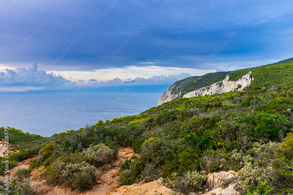 Fototapeta premium Greece, Zakynthos, Hiking trails along abrupt cliffs of navagio beach in twilight