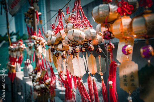Chinese kucky wishes amulets hanging on the wall in the buddhist temple of Wong Tai Sin in Hong Kong.