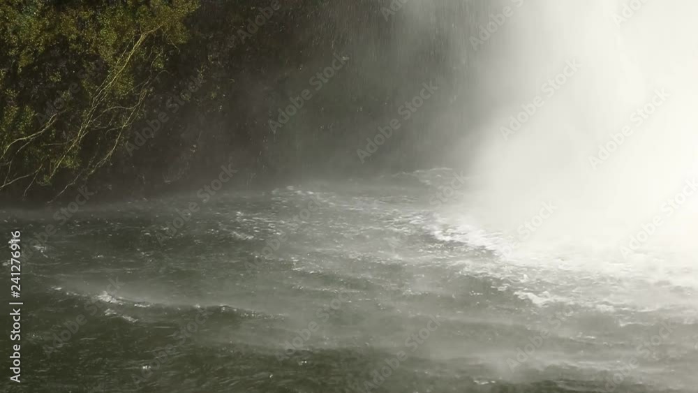Close up of Bottom of Waterfall with Spary and Mist in Shallow Depth of Field