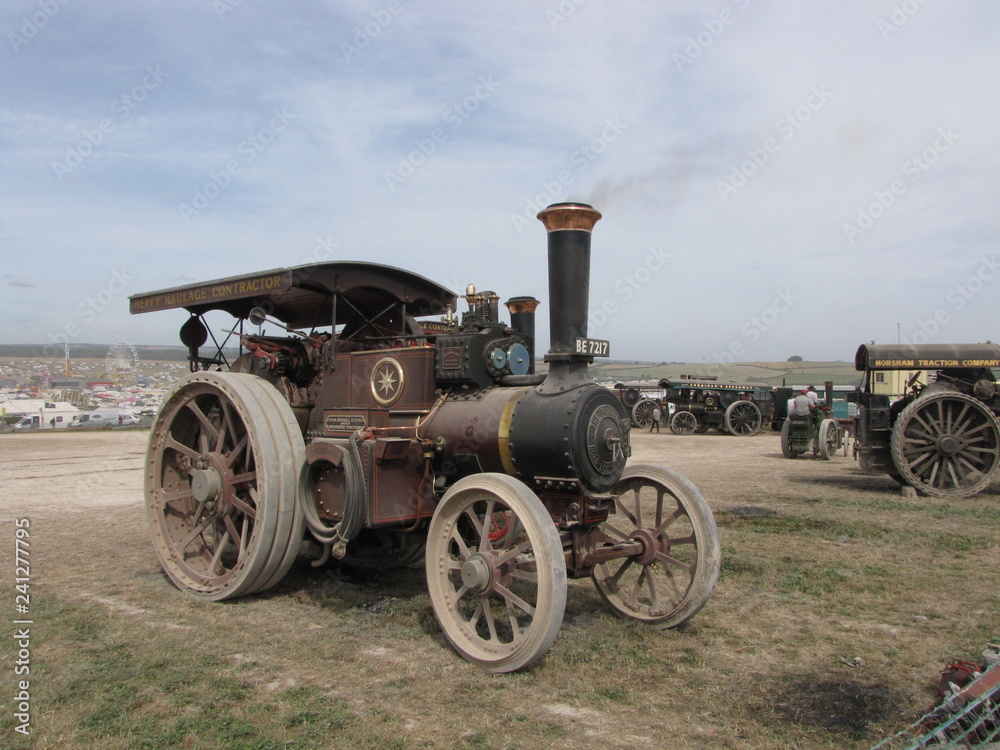 a beautiful historic steam powered engine locomotive at the great dorset steam fair in england closeup