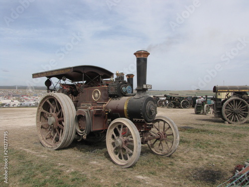 a beautiful historic steam powered engine locomotive at the great dorset steam fair in england closeup