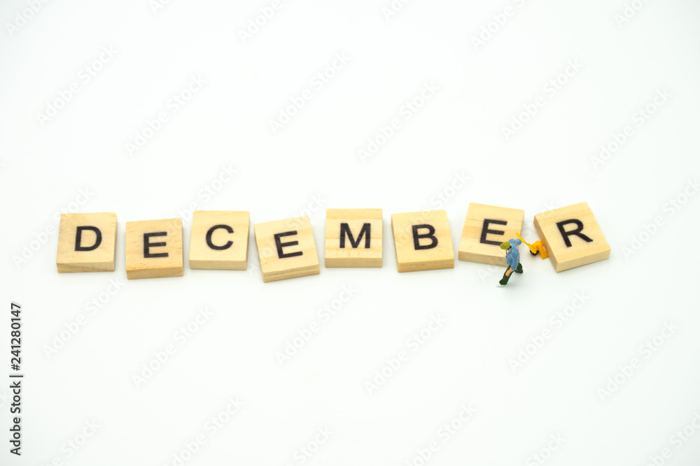 Miniature people Construction worker standing with wood word Month. using as background business concept and calendar concept with copy space for your text Miniature people Construction worker standing with wood word Month. using as background business concept and calendar concept with copy space for your text