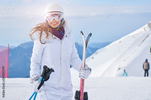 Skier woman on the background of high mountain Winter sport.