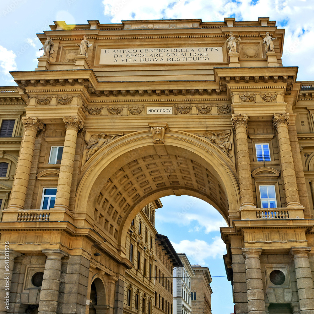 Arcone Triumphal Arch with inscription on the top at the Republic Square in Florence, Italy. The Arch was built in 1895. Tourist attractions. Italian architecture. Landmarks of Italy.