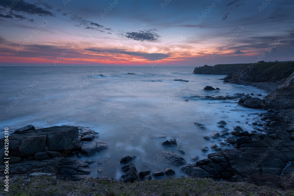 Seascape during sunrise. Beautiful natural seascape. Sea sunrise at the Black Sea coast. Magnificent sunrise with clouds and fire sun at the beginning of April. Seascape during sunrise. Beautiful natural seascape. Sea sunrise at the Black Sea coast. Magnificent sunrise with clouds and fire sun at the beginning of April.