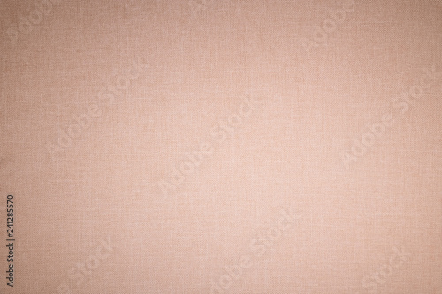 Textured background surface of textile upholstery furniture close-up. beige Color fabric structure