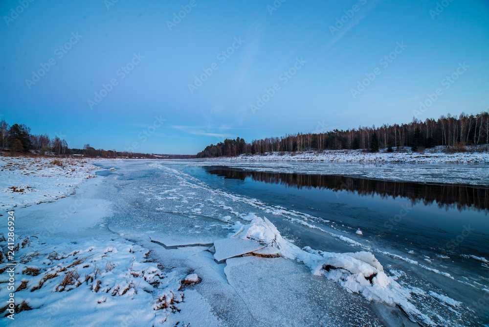 frozen ice and snow in river in winter