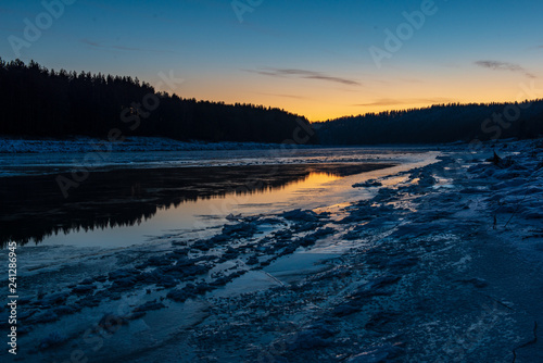 frozen ice and snow in river in winter © Martins Vanags