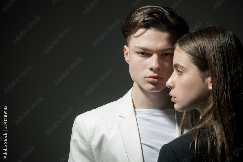 Fashion couple in love. Beauty and fashion. Man and woman. Hair style and skincare. Friendship relations. Family bonds. fashion is our life. man and woman on black background, copy space Fashion couple in love. Beauty and fashion. Man and woman. Hair style and skincare. Friendship relations. Family bonds. fashion is our life. man and woman on black background, copy space