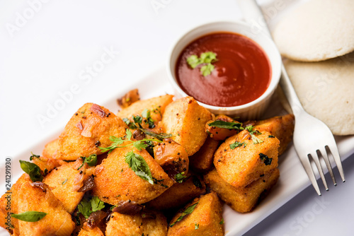 Masala fried Idlies or Idli fry - south indian Snack made using with leftover idly served with tomato ketchup. selective focus