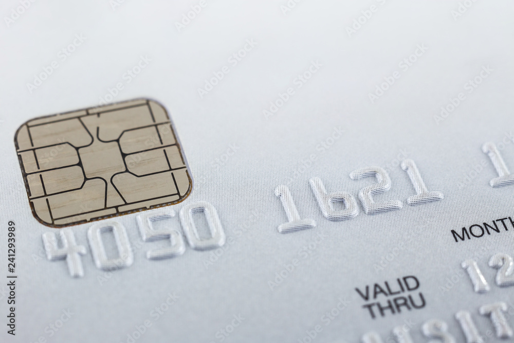 Silver credit card focus on embossed numbers. Silver credit card focus on embossed numbers.