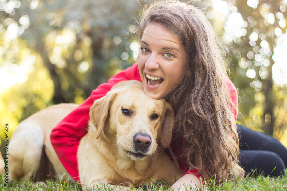 Young smiling woman with her cute dog