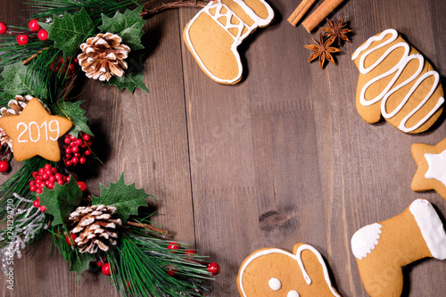 ginger biscuit on brown wood background with Christmas tree 