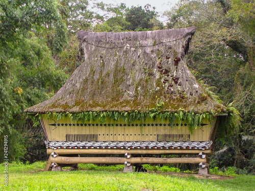 Restored longhouse that belonged to King Simalungan, open air museum in Pematang Purba, Sumatra, Indonesia photo