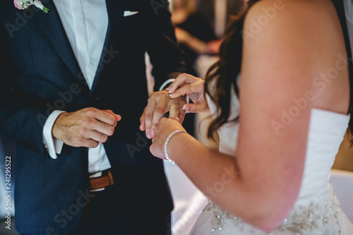 bride and groom exchanging rings © Dennis