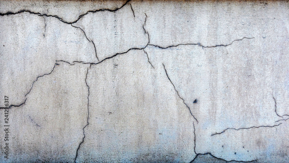 Fototapeta premium Close-up photo. Fragment of masonry wall cracked decorative plaster.