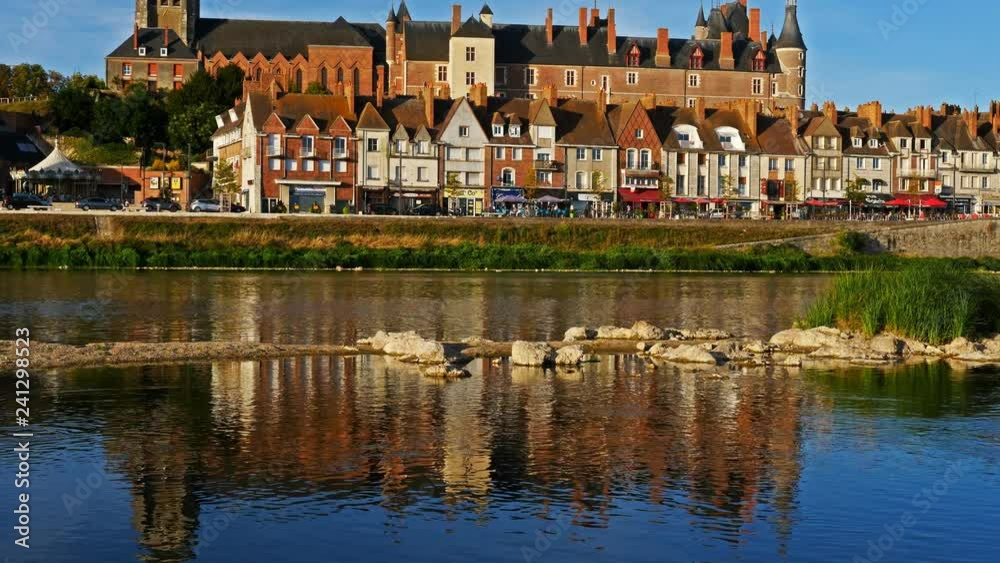 Gien, Loiret, France. The castle and the church overlooking the Loire river. Gien, Loiret, France. The castle and the church overlooking the Loire river.