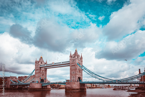 Teal and orange look of Tower Bridge in London ona cloudy day.