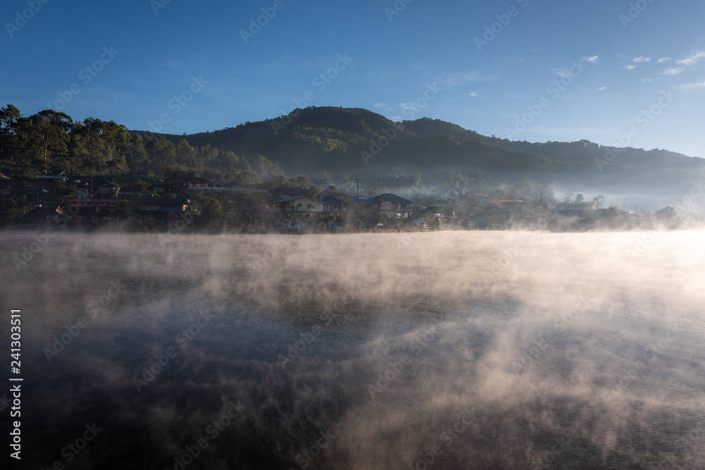Steam floating over the lake at Rakthai village, Mae Hong Son, Thailand