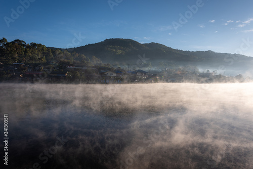 Steam floating over the lake at Rakthai village, Mae Hong Son, Thailand