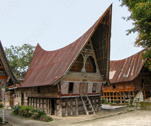 Traditional Batak house at Ambarita, Samosir island, Sumatra, Indonesia photo