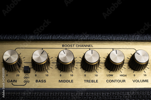 vintage amplifier six knobs horizontal closeup, isolated, copy space on top
