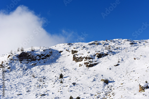 Panoramically view from ski slope over Dolomite mountains in Tre Valli, Italy. - Image photo