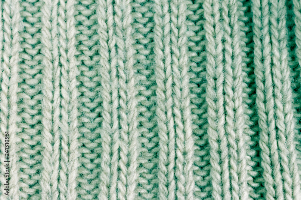 light green cotton knitted fabric texture background. toned image