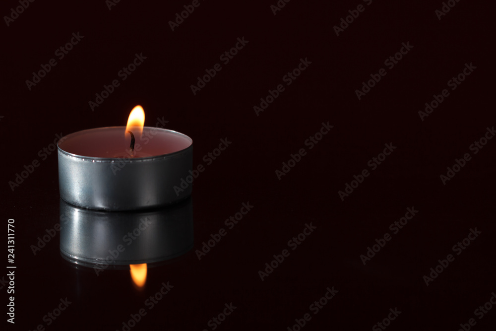 Glass candle with it's reflection