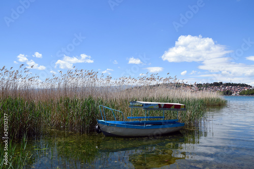 Fototapeta Naklejka Na Ścianę i Meble -  Boat moored in Ohrid Lake. Ohrid Town, Macedonia.