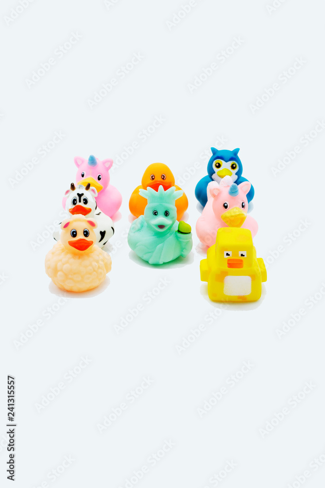 A group of colorful rubber ducks on an isolated white background. A group of colorful rubber ducks on an isolated white background.