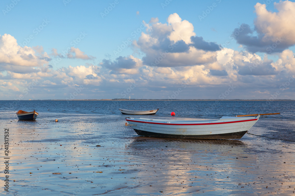 Fishing boats on the empty beach, Hjerting, Jutland, Denmark.