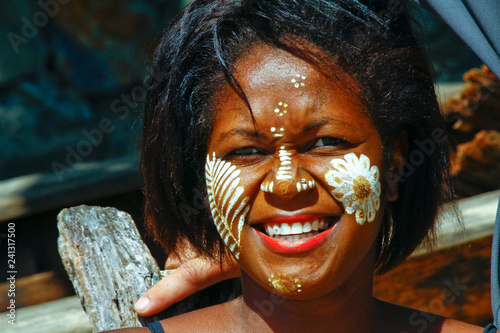 Woman with traditionally painted face, Madagascar